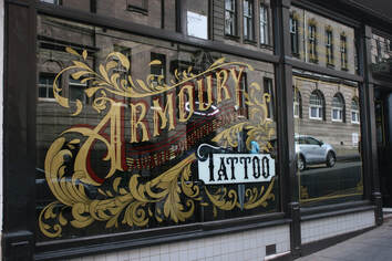 Armoury tattoo store front, calligraphy window art Paisley tattoo studio, armoury custom tattoo studio map street front