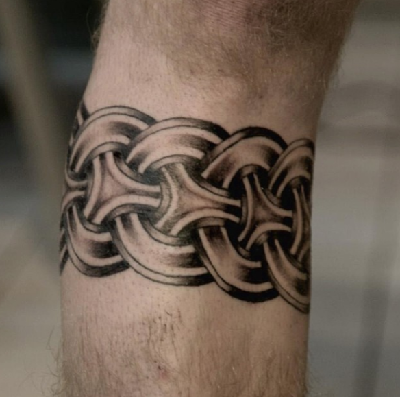 celtic armband tattoo wrist arm band celtic knot work knots pattern design rope viking shading black and grey vegan ink