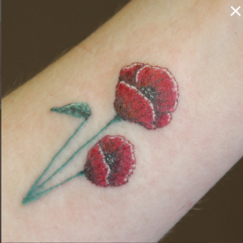 poppy tattoo red flower stem small cute tattoo, memorial tattoo memory meaningful tattoo art floral nature tattoo