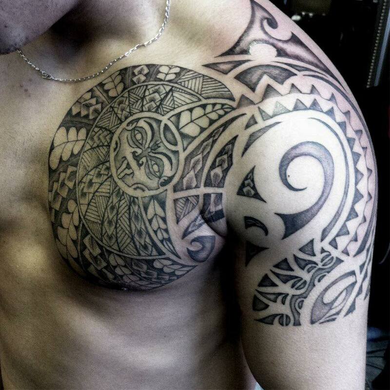 tribal tattoo black and grey chest piece, pattern design traditional